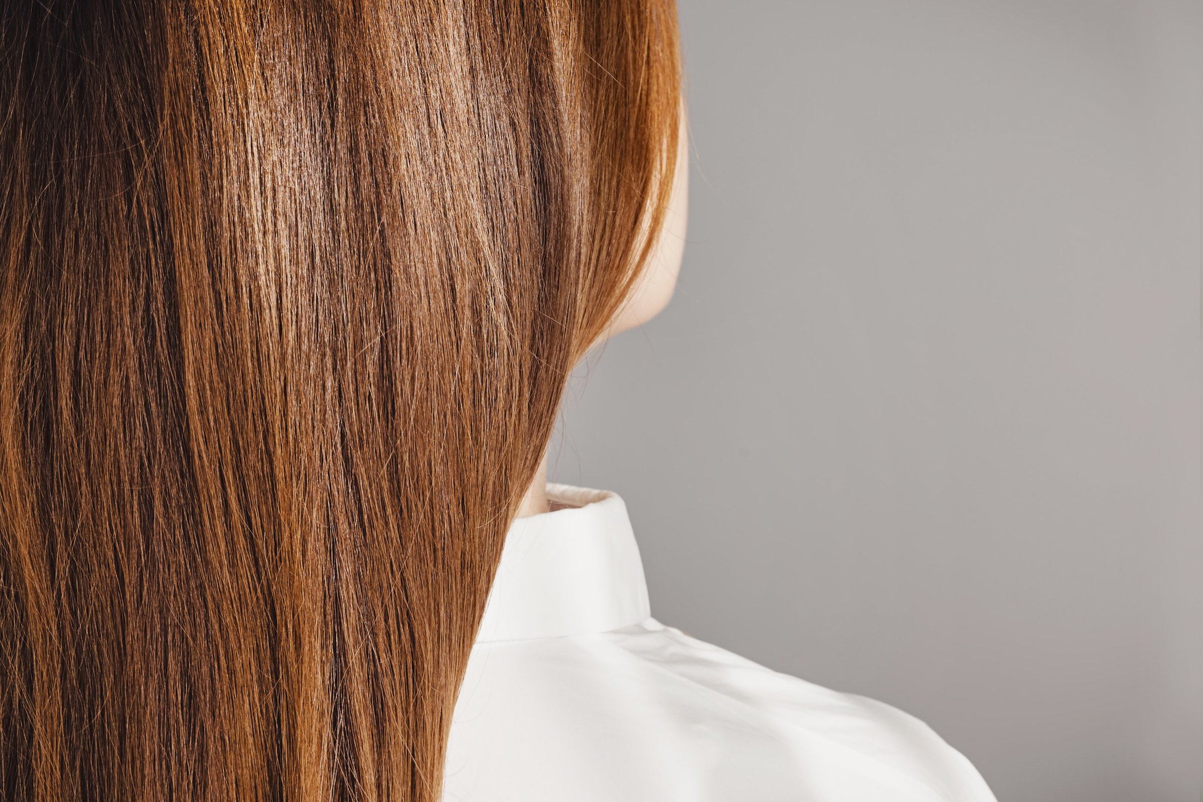 Back View of Young Woman in White Shirt 